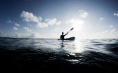Silhouette,Of,Woman,On,Ocean,Kayak
